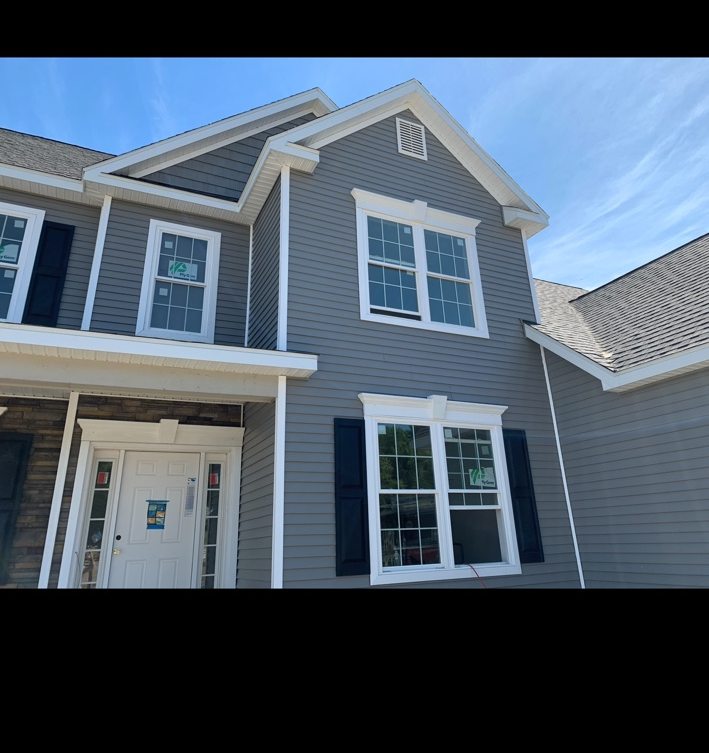 Siding project photograph: Gray Siding with Yellow Entry