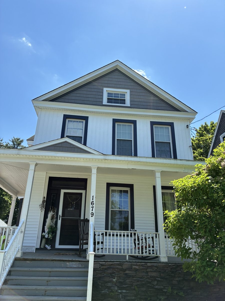Siding project photograph: White Siding with Dark Accents