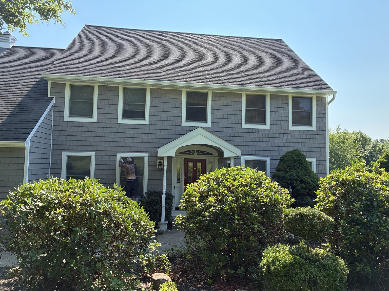 Siding project photograph: Gray Shingle-Style Exterior